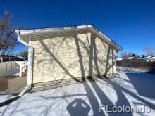 view of snow covered property