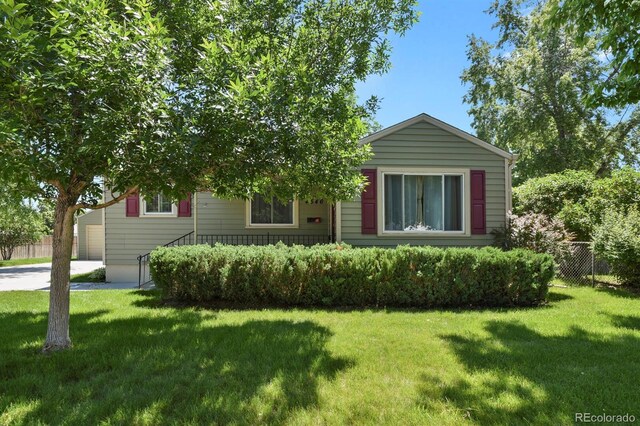 4546 S Logan St, Englewood, CO 80113 - view of front of home with a garage and driveway