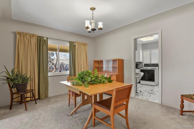 4546 S Logan St, Englewood, CO 80113 - dining space featuring plenty of natural light, a chandelier, and carpet floors