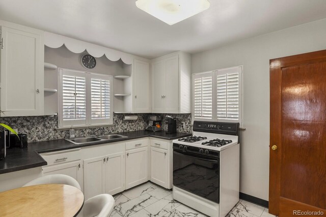 4546 S Logan St, Englewood, CO 80113 - kitchen with gas range oven, open shelves, a sink, and dark countertops
