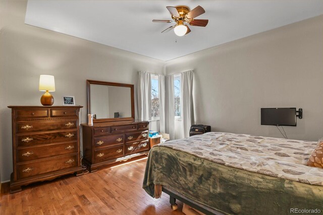 4546 S Logan St, Englewood, CO 80113 - bedroom with light wood finished floors and a ceiling fan