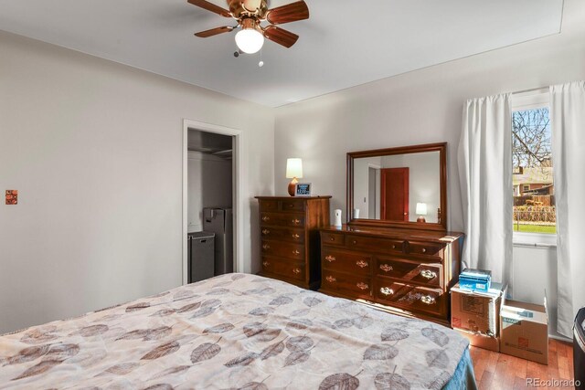 4546 S Logan St, Englewood, CO 80113 - bedroom with wood finished floors and a ceiling fan