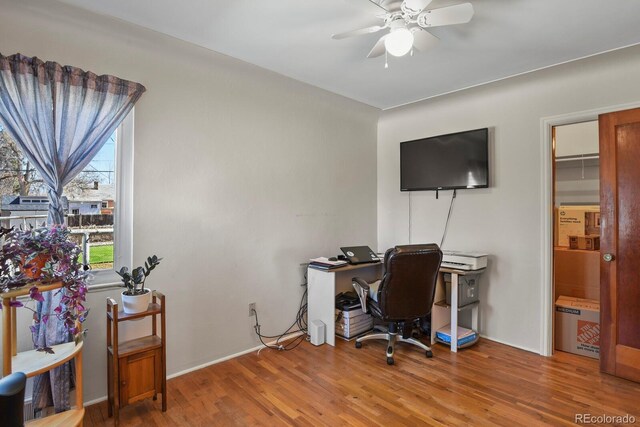 4546 S Logan St, Englewood, CO 80113 - home office featuring wood finished floors and a ceiling fan