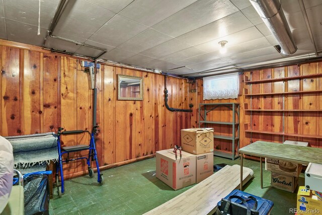 4546 S Logan St, Englewood, CO 80113 - basement featuring wooden walls and tile patterned floors