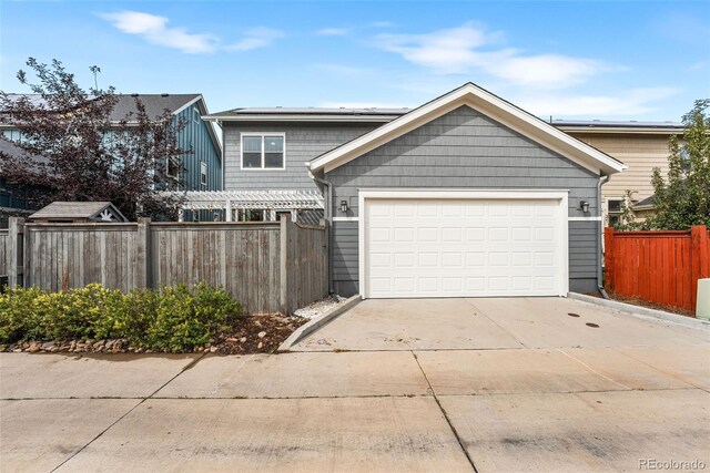 view of front of property featuring a garage