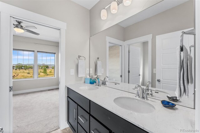 bathroom featuring ceiling fan and vanity