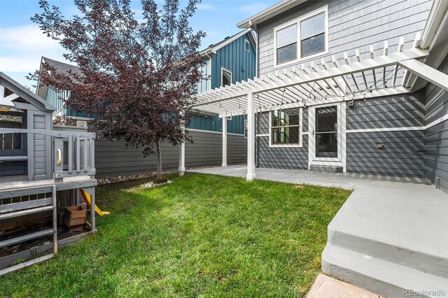 exterior space with a pergola, a patio, and a lawn