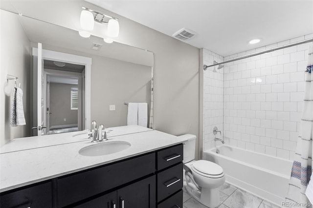 full bathroom with vanity, toilet, and shower / tub combo