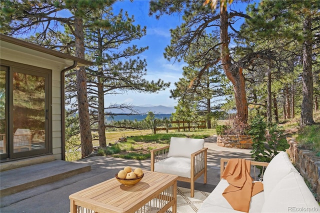 view of patio / terrace featuring a mountain view and outdoor lounge area