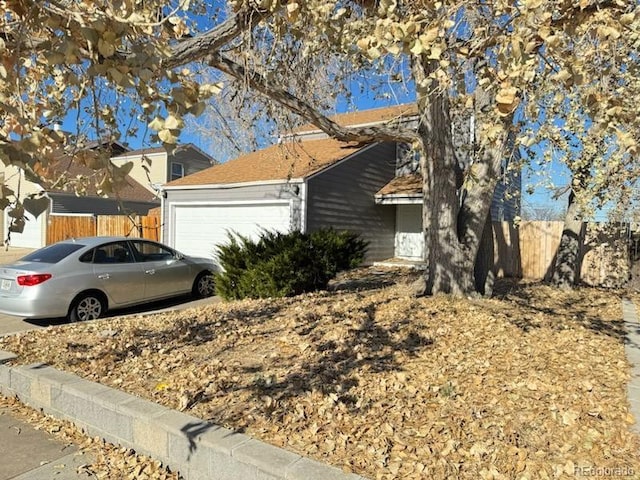 view of property exterior featuring a garage