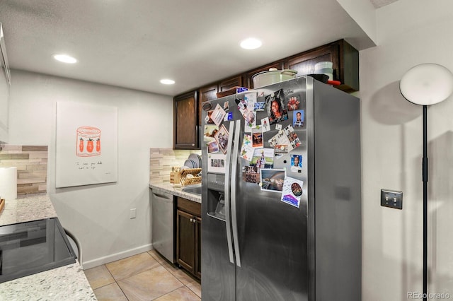 kitchen with backsplash, appliances with stainless steel finishes, dark brown cabinets, recessed lighting, and light tile patterned flooring