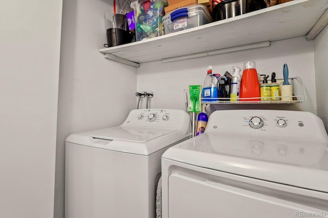 laundry area featuring laundry area and washer and clothes dryer