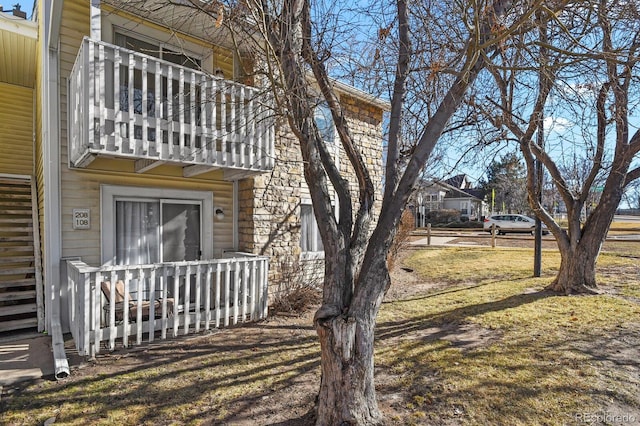 view of home's exterior featuring a balcony