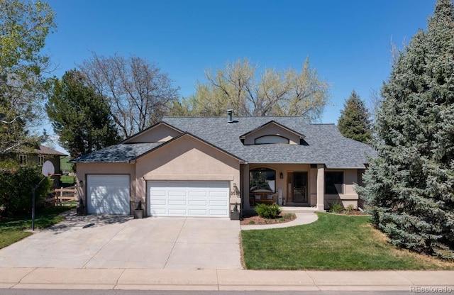 2539 Lake Meadow Dr, Lafayette, CO 80026 - view of front of house with stucco siding, a garage, a front yard, concrete driveway, and roof with shingles