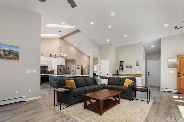2539 Lake Meadow Dr, Lafayette, CO 80026 - living room featuring high vaulted ceiling, light wood-type flooring, beam ceiling, a chandelier, and a baseboard radiator