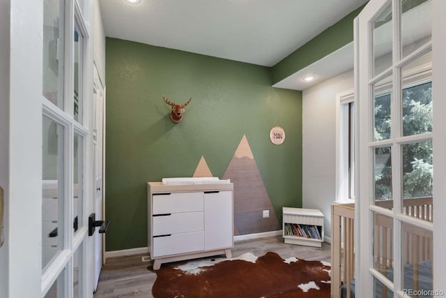 2539 Lake Meadow Dr, Lafayette, CO 80026 - bedroom with french doors, wood finished floors, baseboards, and recessed lighting