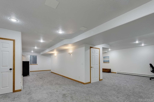 2539 Lake Meadow Dr, Lafayette, CO 80026 - finished below grade area with carpet floors, baseboards, a textured ceiling, and a baseboard heating unit