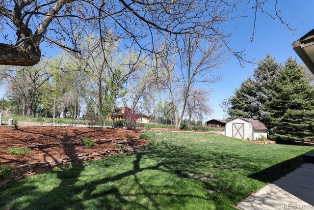 2539 Lake Meadow Dr, Lafayette, CO 80026 - view of green lawn with a shed and an outdoor structure