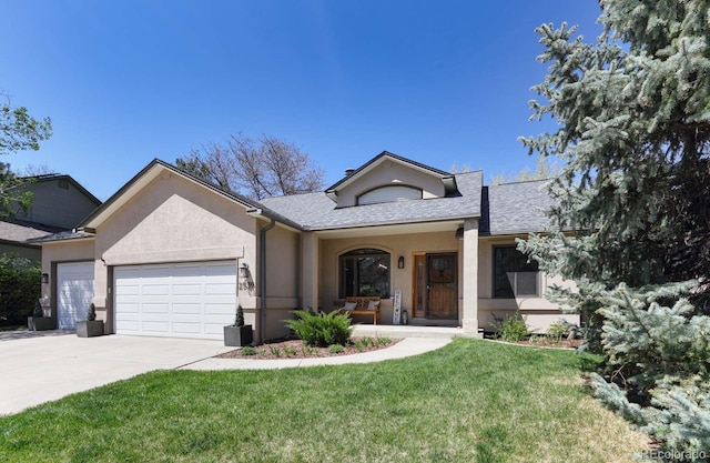 2539 Lake Meadow Dr, Lafayette, CO 80026 - view of front facade featuring an attached garage, a front lawn, stucco siding, and driveway