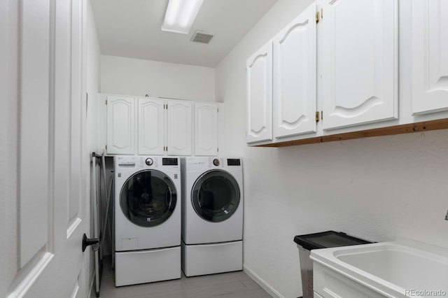 2539 Lake Meadow Dr, Lafayette, CO 80026 - laundry area with washing machine and dryer, cabinet space, and baseboards