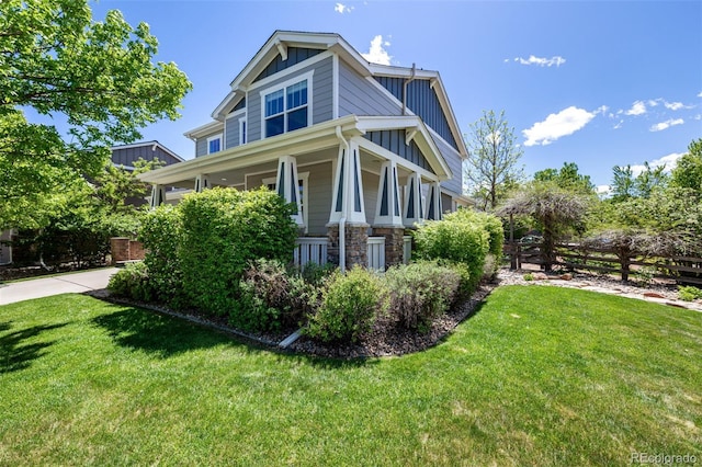 902 Jarvis Dr, Erie, CO 80516 - view of home's exterior with board and batten siding, stone siding, and covered porch