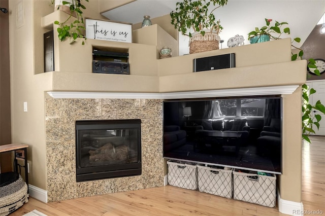 902 Jarvis Dr, Erie, CO 80516 - detailed view of wood finished floors and a high end fireplace