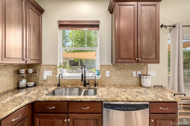 902 Jarvis Dr, Erie, CO 80516 - kitchen featuring dishwasher, a sink, tasteful backsplash, and light stone counters