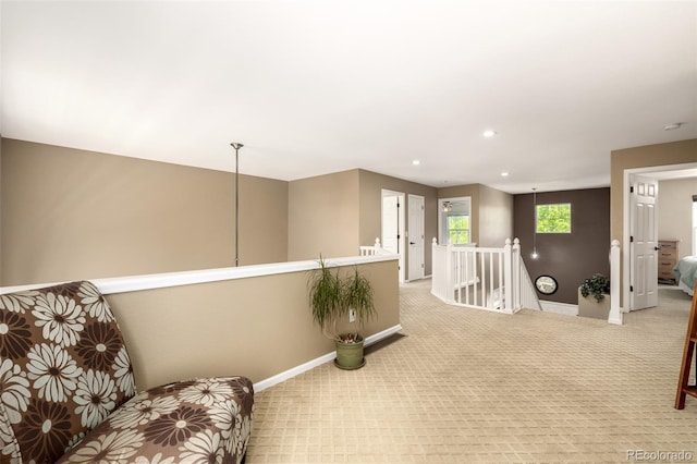902 Jarvis Dr, Erie, CO 80516 - living area featuring an upstairs landing, baseboards, light carpet, and recessed lighting