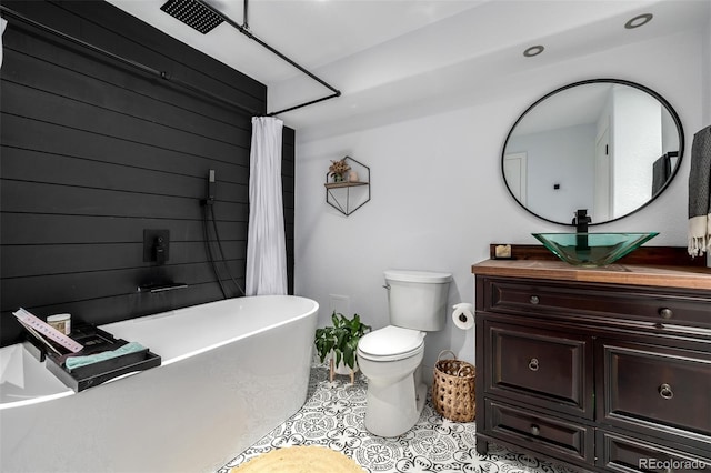 902 Jarvis Dr, Erie, CO 80516 - bathroom featuring a soaking tub, vanity, tile patterned floors, toilet, and a shower with shower curtain