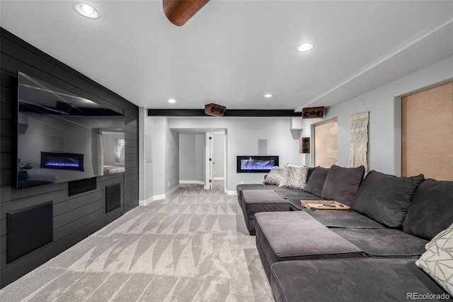 902 Jarvis Dr, Erie, CO 80516 - carpeted living room featuring a glass covered fireplace, recessed lighting, and baseboards