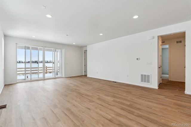 unfurnished room featuring light hardwood / wood-style flooring