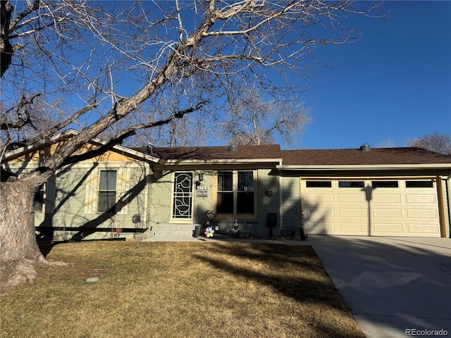 ranch-style home featuring a garage, entry steps, concrete driveway, and a front lawn