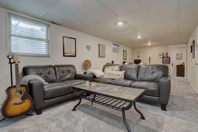 living area with a drop ceiling, carpet flooring, visible vents, and recessed lighting