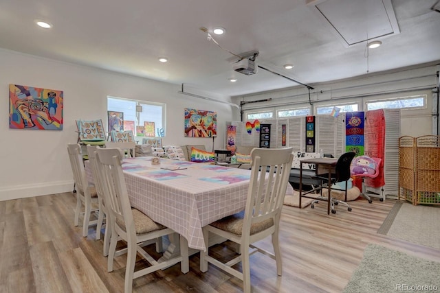 dining room featuring baseboards, recessed lighting, attic access, and light wood-style floors