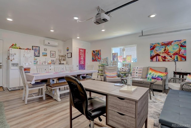 office with light wood finished floors, an AC wall unit, and recessed lighting