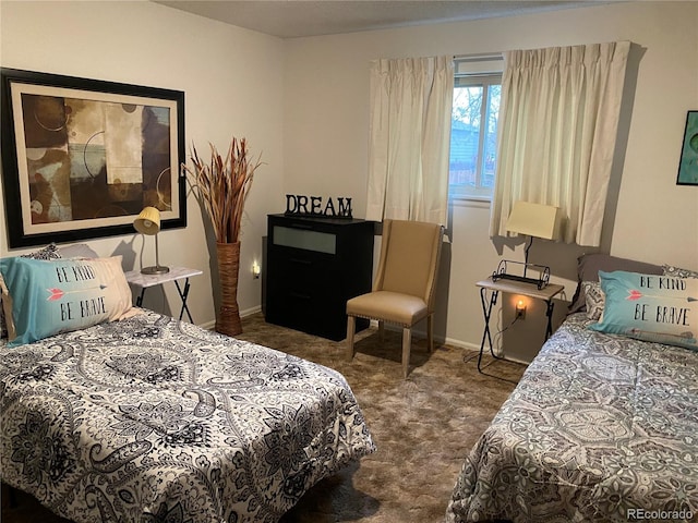 carpeted bedroom with baseboards