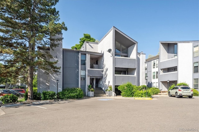 6490 S Dayton St Unit L02, Englewood, CO 80111 - view of apartment building / complex featuring uncovered parking