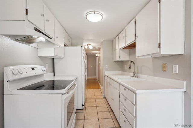 6490 S Dayton St Unit L02, Englewood, CO 80111 - kitchen featuring white appliances, white cabinets, light tile patterned flooring, and light countertops