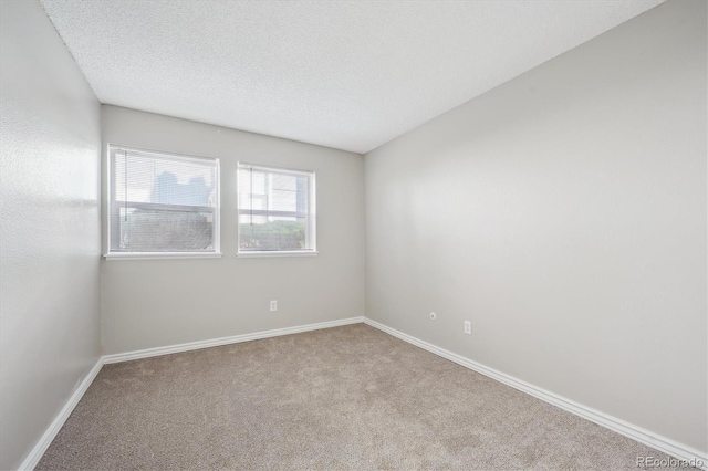 6490 S Dayton St Unit L02, Englewood, CO 80111 - unfurnished room with carpet flooring and a textured ceiling