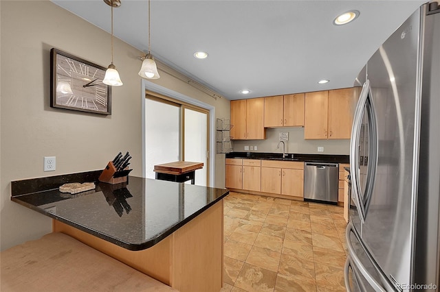 kitchen featuring light brown cabinets, a sink, appliances with stainless steel finishes, a peninsula, and recessed lighting