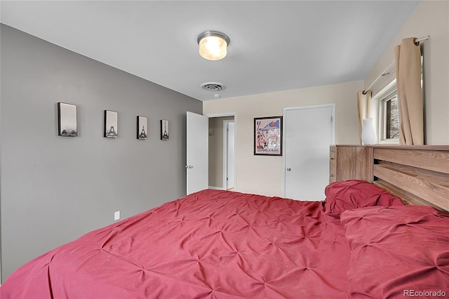 bedroom with visible vents