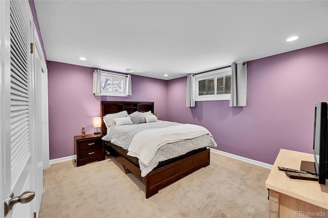 bedroom featuring light carpet, baseboards, and recessed lighting