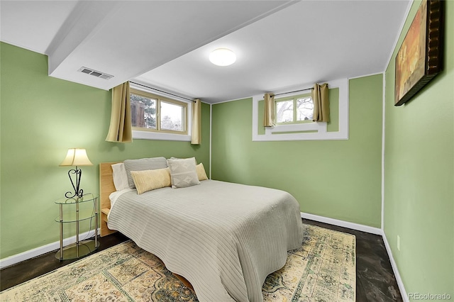 bedroom with visible vents and baseboards