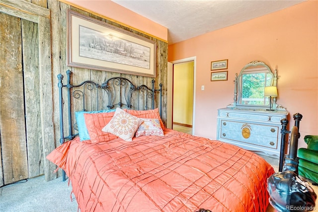 bedroom featuring carpet floors and a textured ceiling