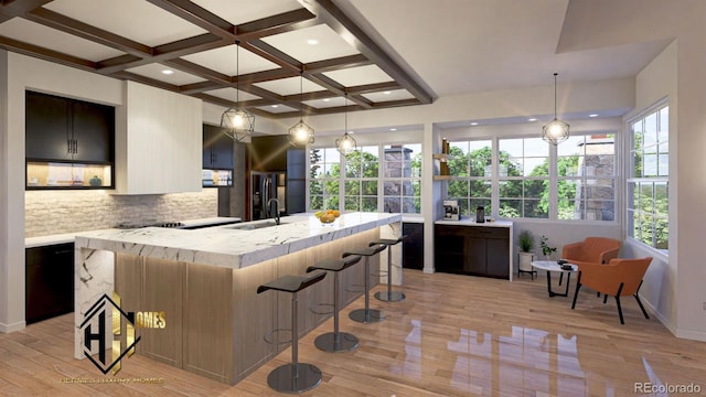 7969 Forest Keep Cir, Parker, CO 80134 - kitchen with coffered ceiling, light wood-type flooring, decorative backsplash, a breakfast bar, and beam ceiling