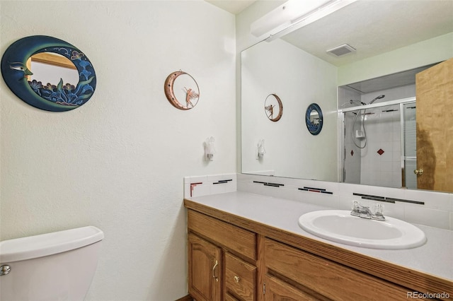 full bathroom featuring visible vents, a shower stall, toilet, decorative backsplash, and vanity