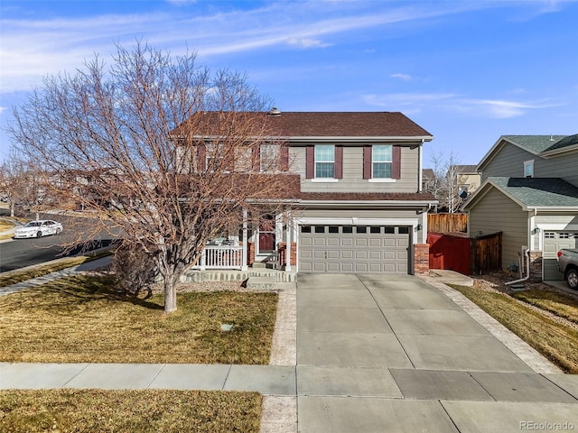 view of front of house with a porch, a front yard, and a garage