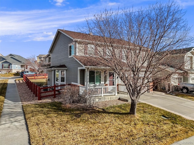 view of front of house featuring a porch and a front yard