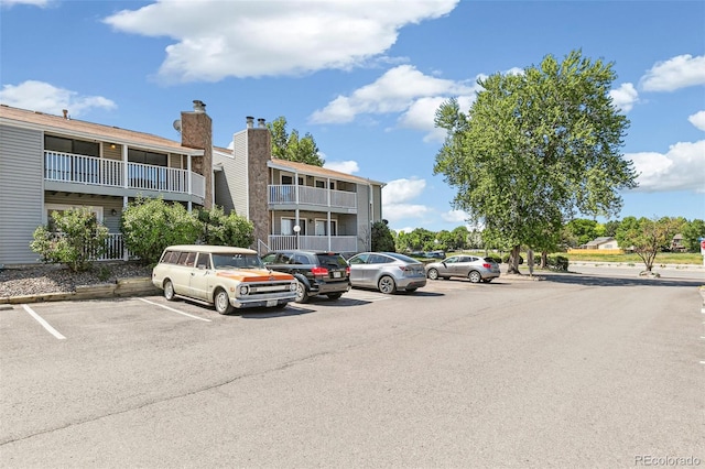 18302 E Kepner Pl Unit 207, Aurora, CO 80017 - view of building exterior featuring uncovered parking