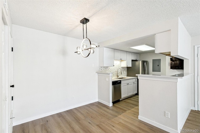18302 E Kepner Pl Unit 207, Aurora, CO 80017 - kitchen with stainless steel dishwasher, electric panel, light wood finished floors, tasteful backsplash, and light countertops